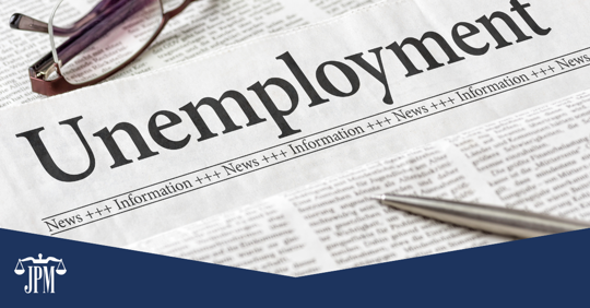 A newspaper with "Unemployment" as the headline.